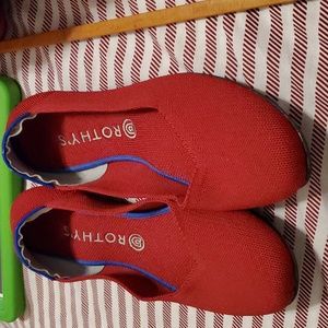 One pair of red round toe Rothys size 11